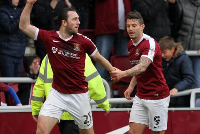 John-Joe O'Toole and Marc Richards celebrate the Cobblers' second goal against Charlton