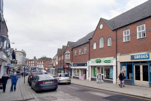 The woman was walking from Rushden High Street to the car park when the robbery took place