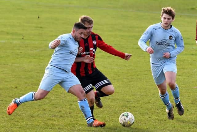 Action from premier division leaders Kettering Nomads' 1-0 win at Brixworth All Saints (Pictures: Dave Ikin)