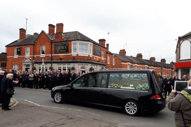 Peter Russell's procession passes by his former pub, the Crown & Cushion, in Wellingborough Road.