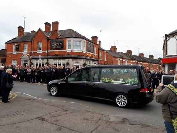 Peter Russell's procession passes by his former pub, the Crown & Cushion, in Wellingborough Road.