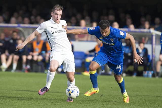 HARD-FOUGHT BATTLE: Action from Saturday's game between Northampton and Kingsmeadow. Picture by Kirsty Edmonds