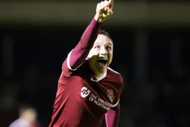 GOAL GLEE! - Matt Taylor celebrates his late winning goal (Pictures: Kirsty Edmonds)