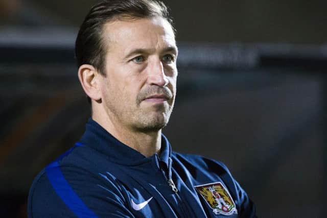 Justin Edinburgh watches his team see off Port Vale