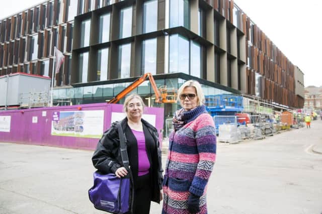 Angel Street's new park and ride scheme has come under scrutiny. From left, Ged Carlton and Penny Smith of Northants Unison outside the new Angel Street development NNL-170313-172908009