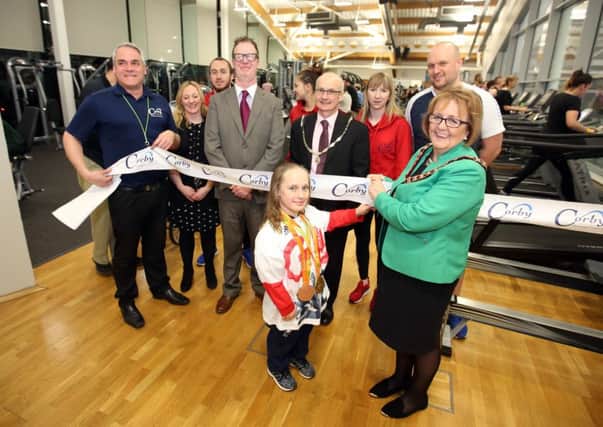 Ellie Robinson, who swims for Northampton Swimming Club and trains once a week at Corby International Swimming Pool, helps to relaunch the gym with Mayor of Corby Julie Riley