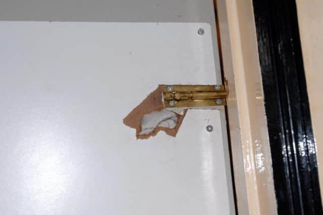 A peephole cut into a bedroom door was used as part of the couple's offending.