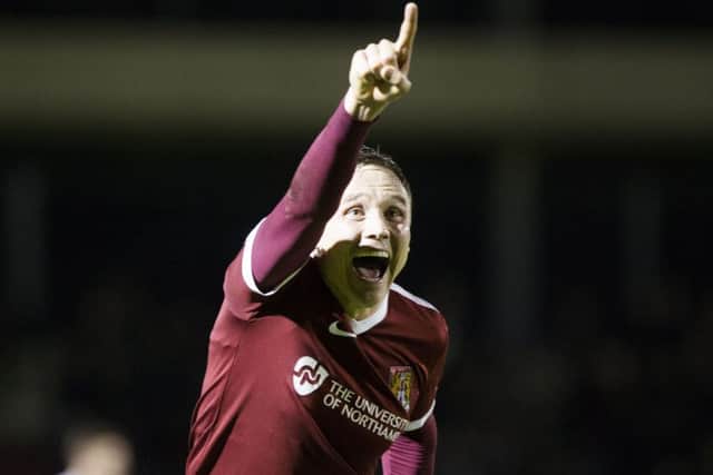 SMILES BETTER - Matt Taylor celebrates his winner against Port Vale (Pictures: Kirsty Edmonds)