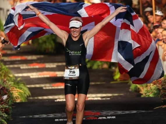 Frances crosses the finish line at the Ironman triathlon. This year's marathon will be her 16th.
