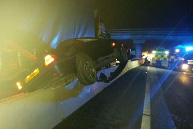 Wesley's car mounted the concrete barrier, pinned into the air and dragged along the motorway.