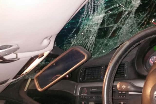 The passenger-seat side of Wesley's car was crushed in the accident. Fortunately, Wesley was driving alone when it happened.