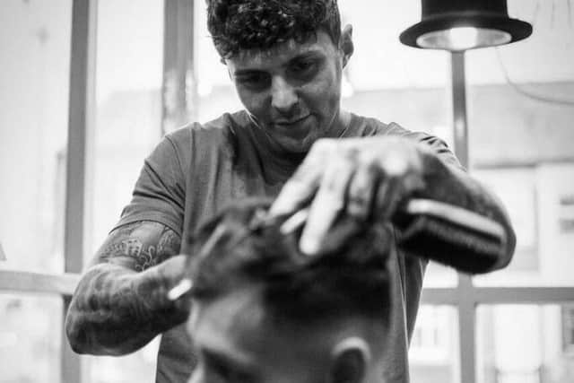 A barber working in the shop