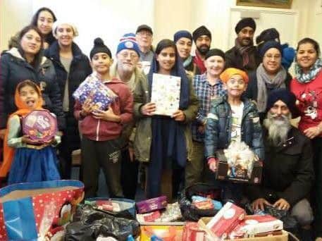 Members of the Northampton Inter Faith Forum with gifts for their Christmas appeal in December 2016.