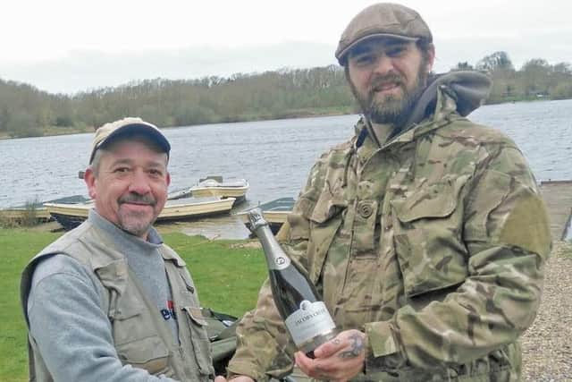 RINGSTEAD'S opening day brought Sean Roe (left) some good trout and a bottle of bubbly from bailiff Pete Booth