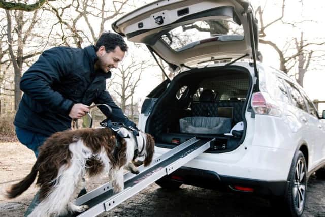 Features include a slide-away ramp for easier access.