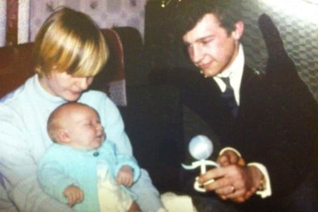 Jenny and Chuck with their first son, Brian.