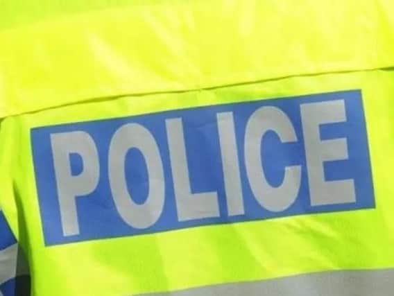 A takeaway delivery driver was robbed of cash and took a blow to the head in Northampton
