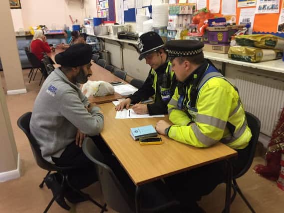 Amarjit Singh Atwal talks to police about the hate crimes at the St George's Street gurdwara.