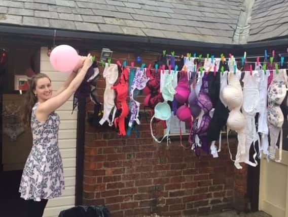 Becky Green fills the Sheer Delights amnesty washing line with donated bras.