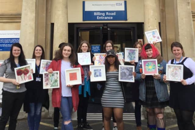 Northampton College Level 3 art and design students with the spring-inspired artwork donated to Northampton General Hospital