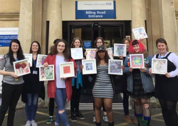 Northampton College Level 3 art and design students with the spring-inspired artwork donated to Northampton General Hospital