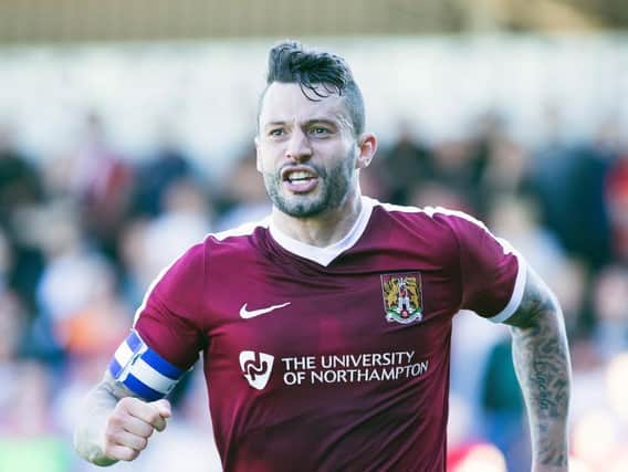 Marc Richards celebrates after firing the Cobblers ahead (Pictures: Kirsty Edmonds)