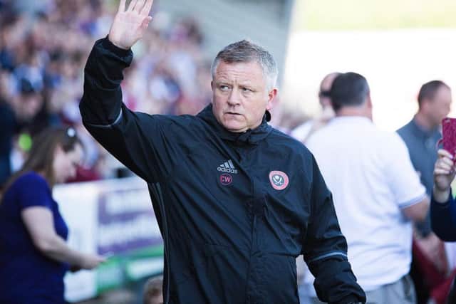 Chris Wilder acknowledges the Cobblers supporters before kick off