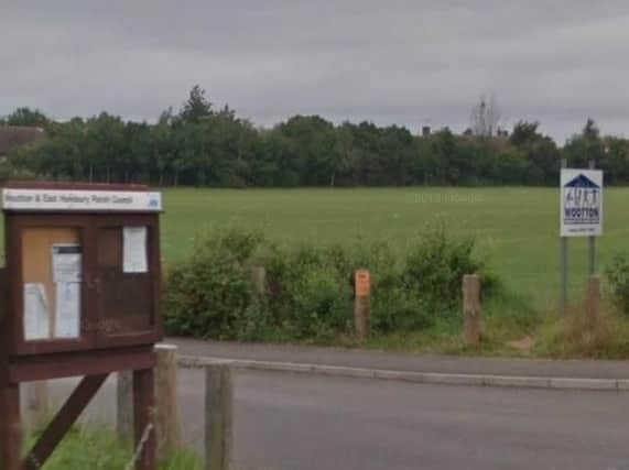 A man was head-butted by a dog walker following a row in a Wootton playing field.