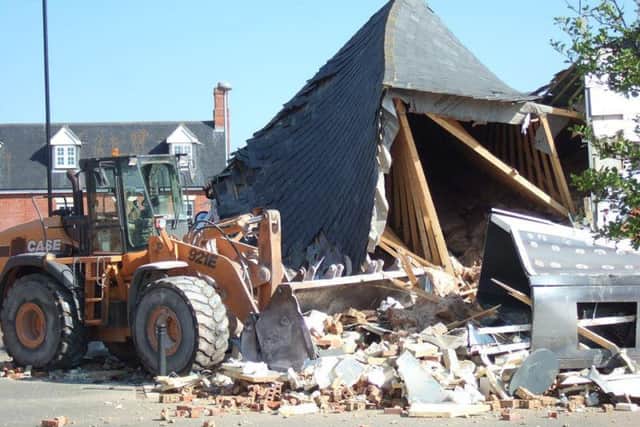 The aftermath of the One Stop Shop ram-raid shows the roof almost entirely collapsed by the digger. Pictures by John Wright.