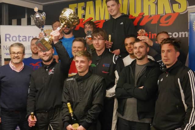 Winners were received their trophy from BBC Northampton presenter John Griff