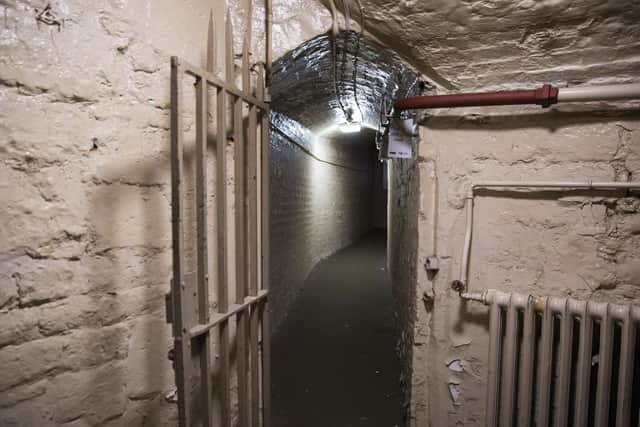 The corridor to the courtrooms and holding cells.