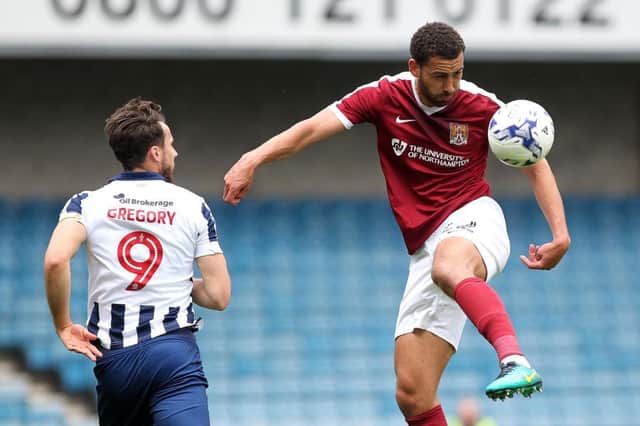 DAY TO FORGET: Lewin Nyatanga controls the ball during Northampton's defeat to MIllwall. Pictures: Sharon Lucey