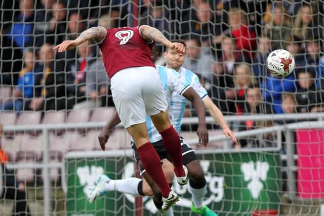 Marc Richards heads the Cobblers into a 1-0 lead against Shrewsbury at Sixfields (Picture: Sharon Lucey)