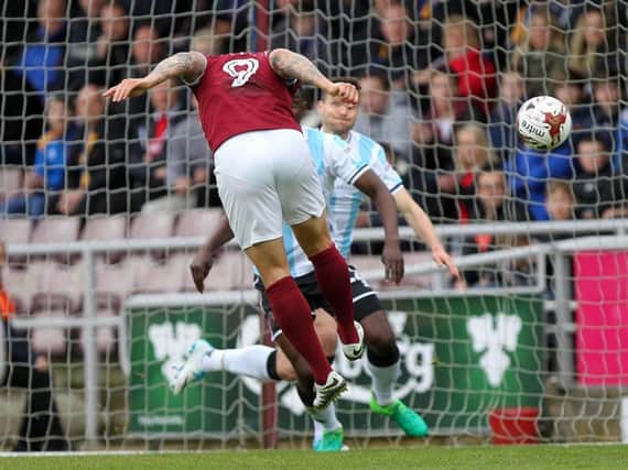 Marc Richards heads the Cobblers into a 1-0 lead against Shrewsbury at Sixfields (Picture: Sharon Lucey)