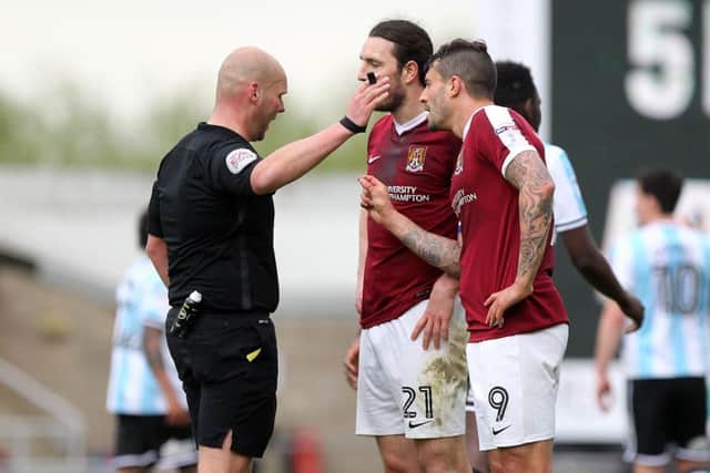 SEEING RED: Cobblers had two men sent off in the same game for the first time since 2004, also against Shrewsbury. Pictures: Sharon Lucey