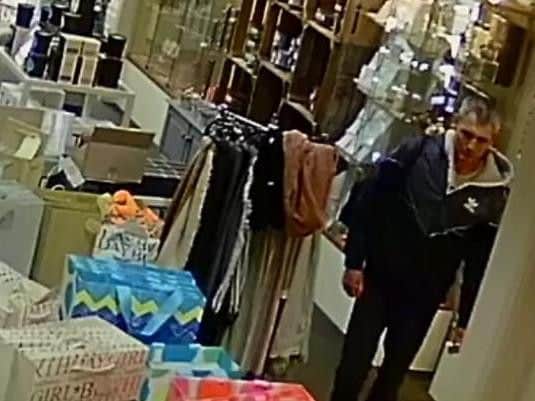 This man is believed to have loaded expensive candles into a rucksack at Peppertrees.