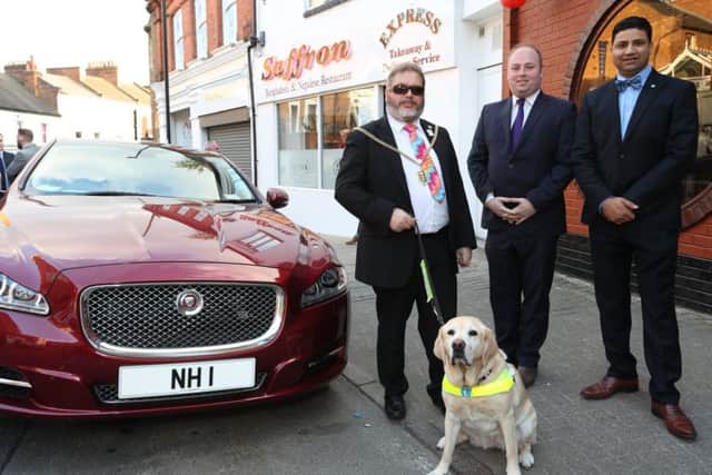 Mayor Christopher Malpas (left) with his guide dog Verity with David Mackintosh MP and Naz Islam, of the Saffron restaurant