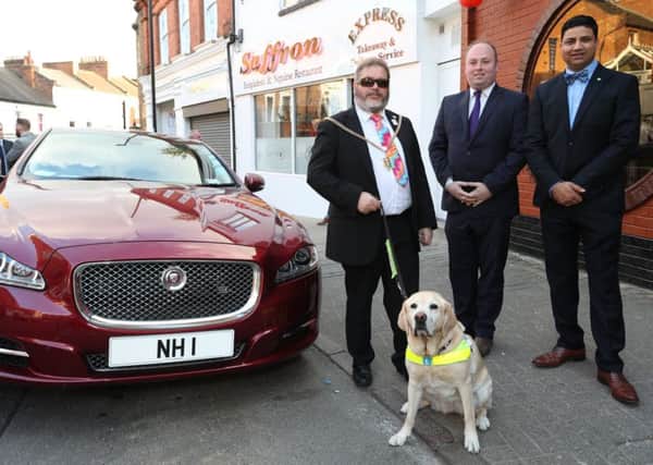Mayor Christopher Malpas (left) with his guide dog Verity with David Mackintosh MP and Naz Islam, of the Saffron restaurant