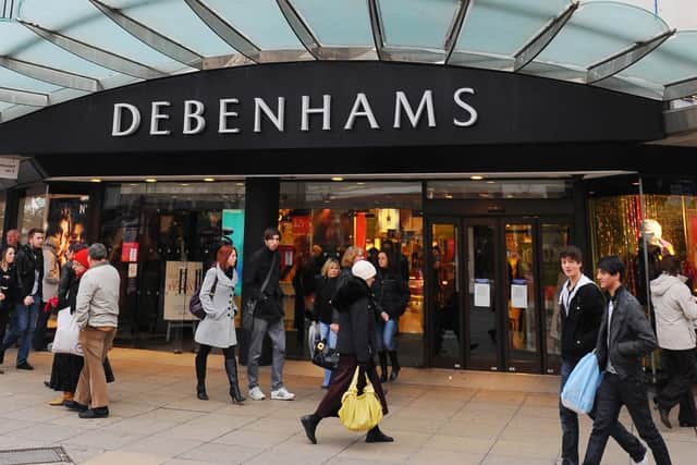 Debenhams stores are also under review after pre-tax profits fell.
