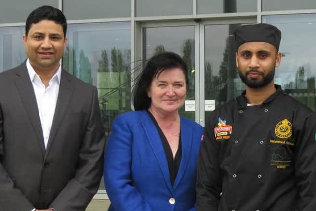 Saffron owner Naz Islam with Mohammad and Northampton College principal Pat Brennan-Barrett