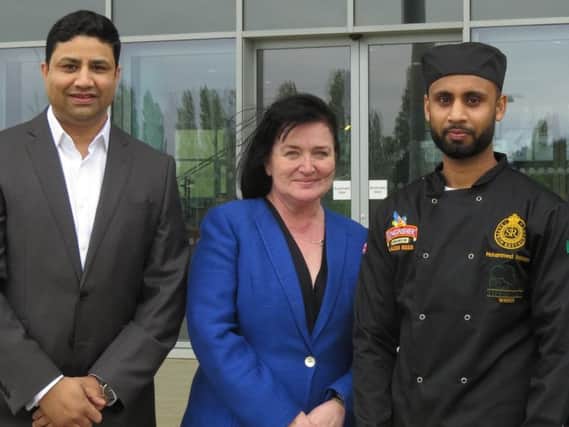 Saffron owner Naz Islam with Mohammad and Northampton College principal Pat Brennan-Barrett