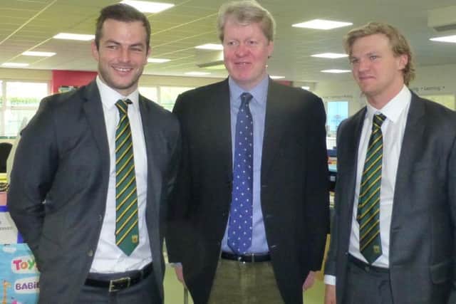 Saints players Stephen Myler and Tom Stephenson with Lord Spencer (middle).