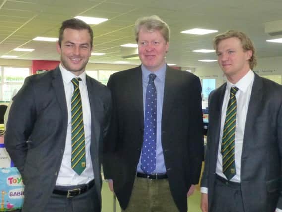 Saints players Stephen Myler and Tom Stephenson with Lord Spencer (middle).