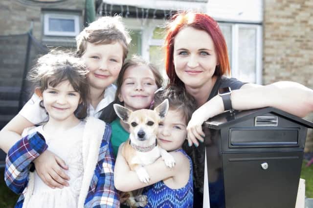 Summer Martin, Jacob Martin, Lani Wati, Willow Martin and Sarah Martin with their pet chihuahua Tiny
