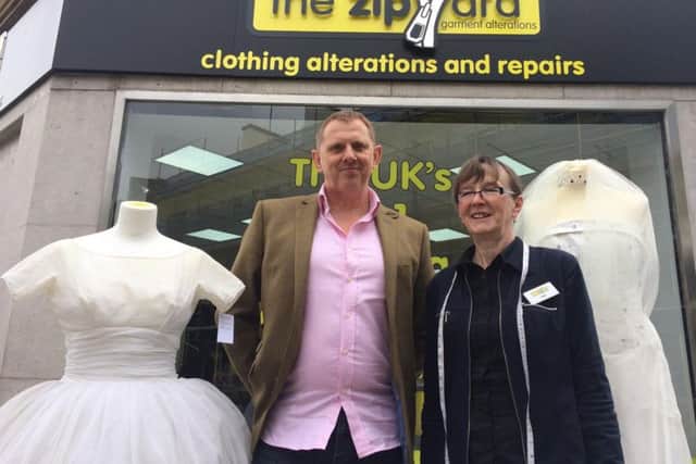 Ian Tarvit with the head seamstress at the Zipyard.