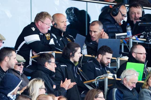 The Saints coaches watched on as their team were well beaten