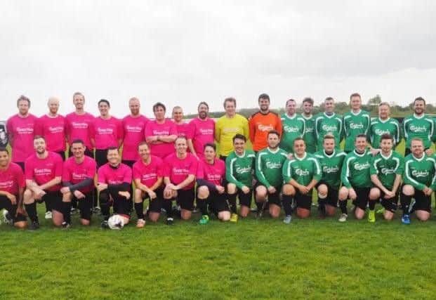 The teams from Avon and Carlsberg who took part in the football match for Crazy Hats