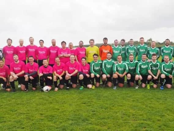 The teams from Avon and Carlsberg who took part in the football match for Crazy Hats