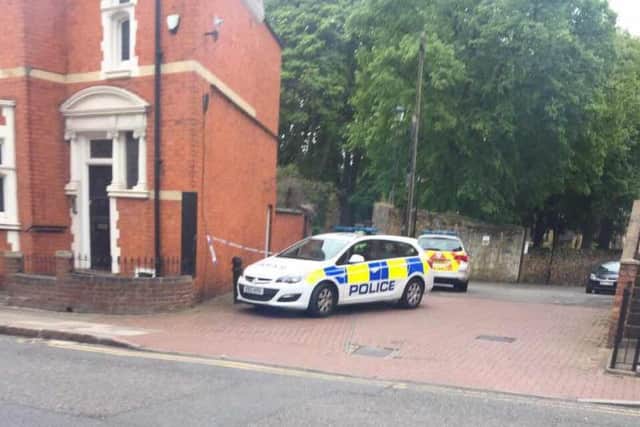 Police officers at the churchyard at St Giles Church this morning