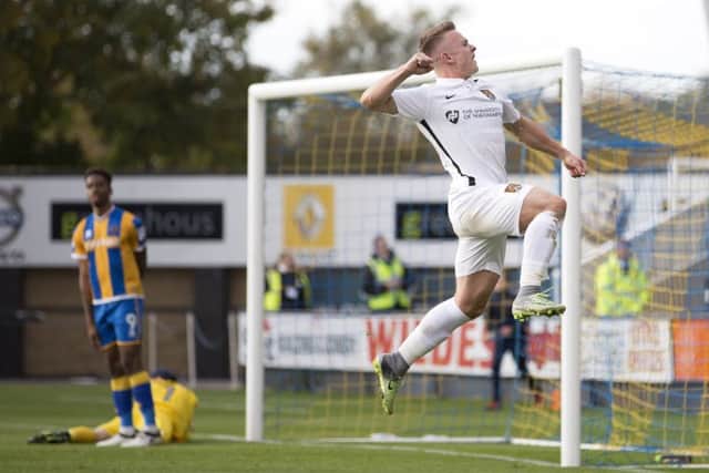 MOST IMPROVED: Sam Hoskins celebrates his goal at Shrewsbury